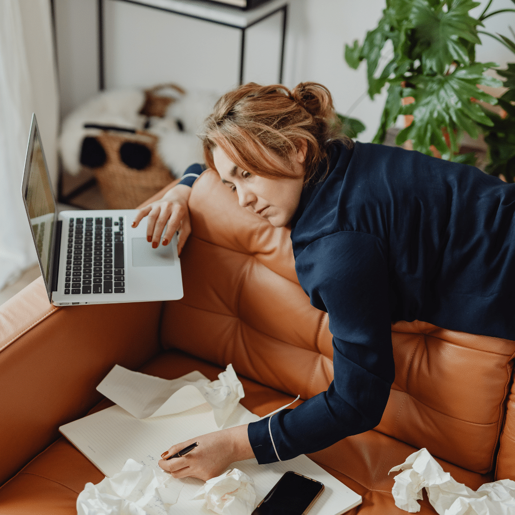 Exhausted professional struggling with work stress and burnout symptoms while working from home