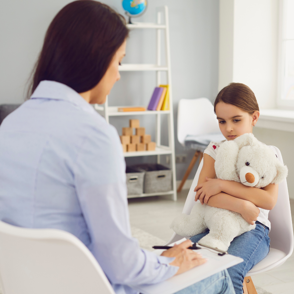 Child meeting with a mental health professional for evaluation and treatment of school refusal anxiety and emotional distress.