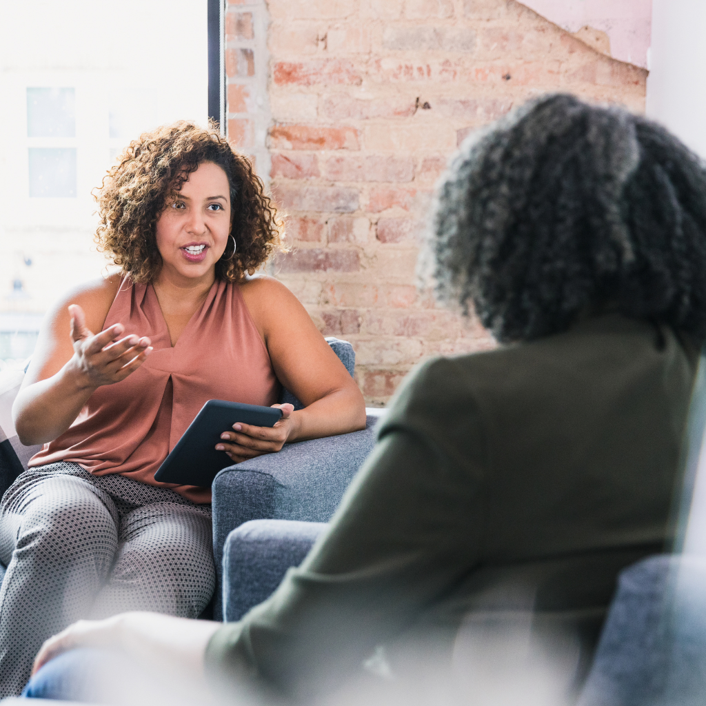 ADHD Perimenopause Women: Why ADHD Often Gets Harder During Midlife 2 Woman meeting with a clinician to discuss ADHD treatment and hormone therapy during perimenopause.