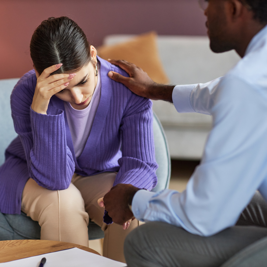 Therapist supporting a patient during an ERP therapy session for OCD reassurance-seeking compulsions and anxiety management.