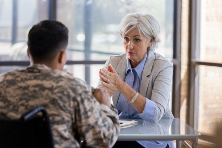 Military service member talking with a therapist about mental health support and career concerns.