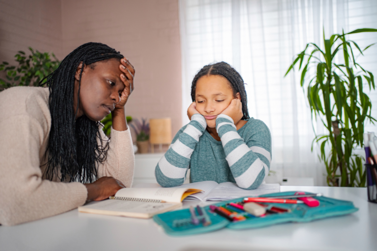 Animo Sano Psychiatry 41 Parent and child sitting together during a difficult homework moment, reflecting common ADHD homework help challenges.