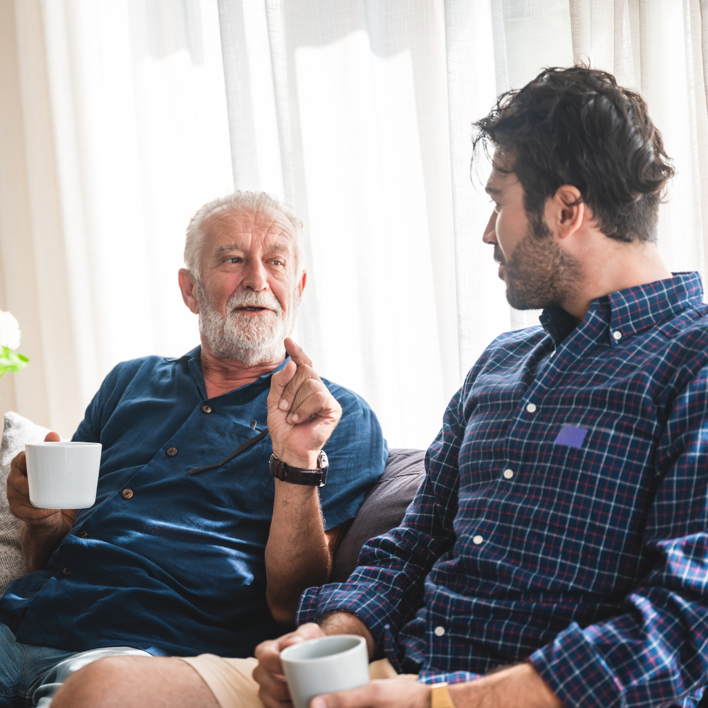 Late-Life Depression: What Families Need to Know 2 Son having a thoughtful conversation with his aging parent at home.