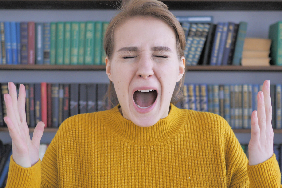 Teen showing intense frustration during an emotional meltdown, reflecting teen emotional dysregulation.