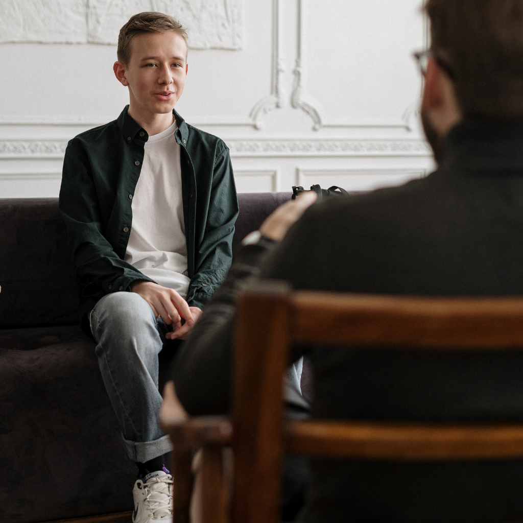 Teen speaking with a mental health provider about emotional outbursts and when support may be needed.