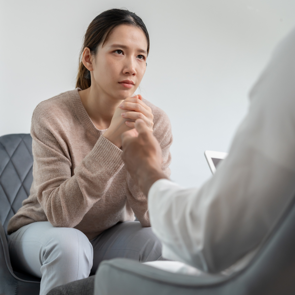 Adult speaking with a provider about how ADHD hyperfocus affects daily routines, responsibilities, and support needs.