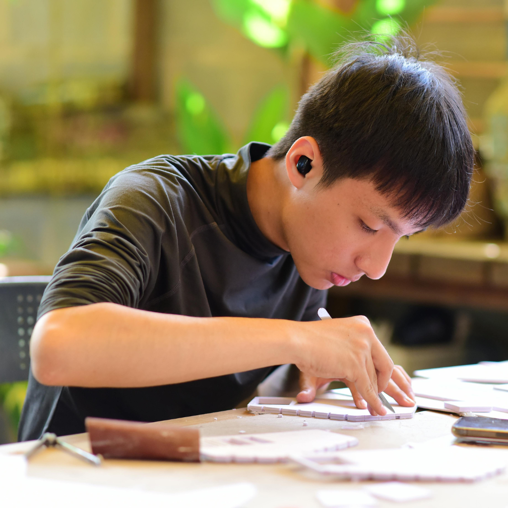 A person focused on a detailed task, showing how ADHD hyperfocus can absorb attention for long periods
