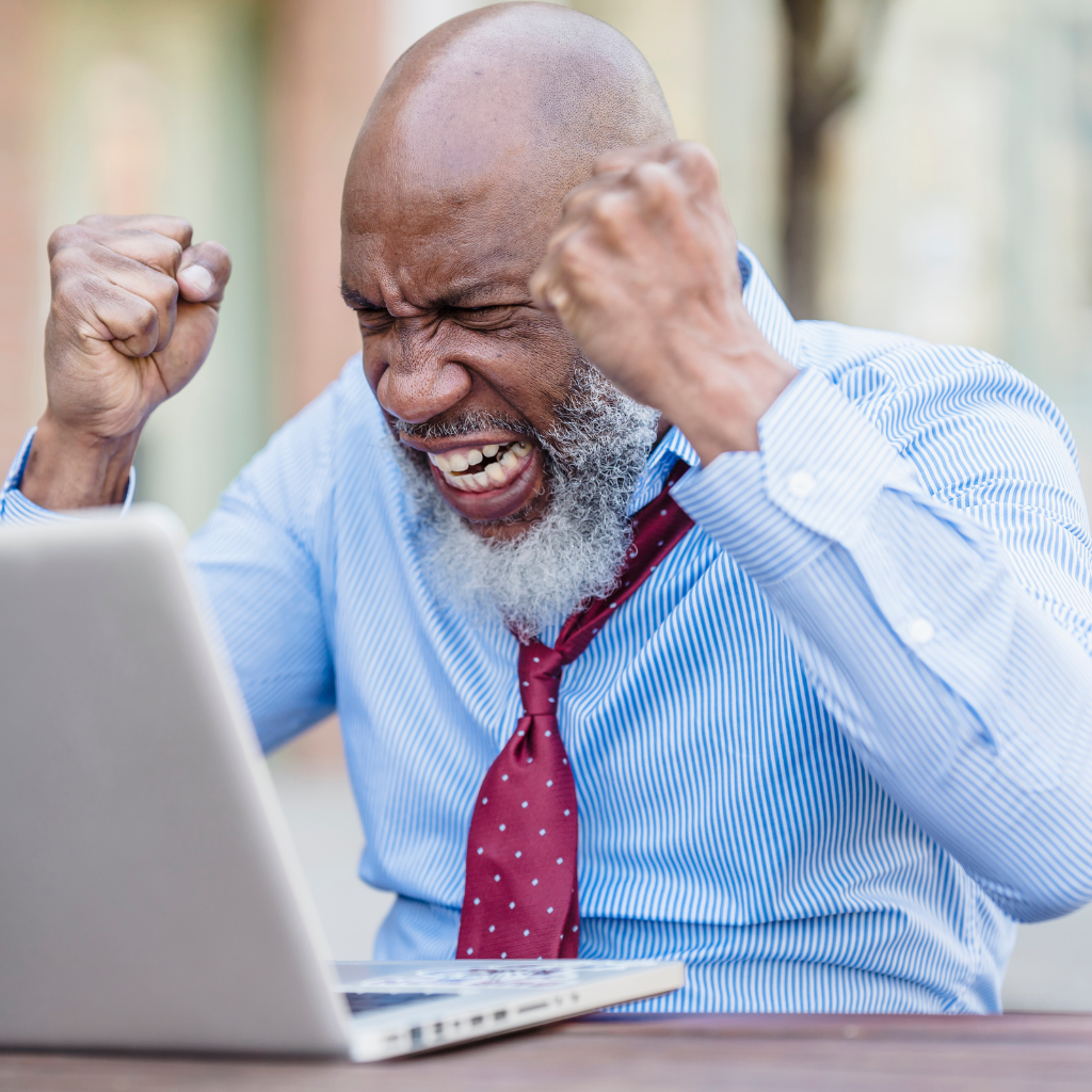 Man reacting intensely at a laptop, showing how emotional dysregulation in BPD can feel sudden, overwhelming, and hard to settle.