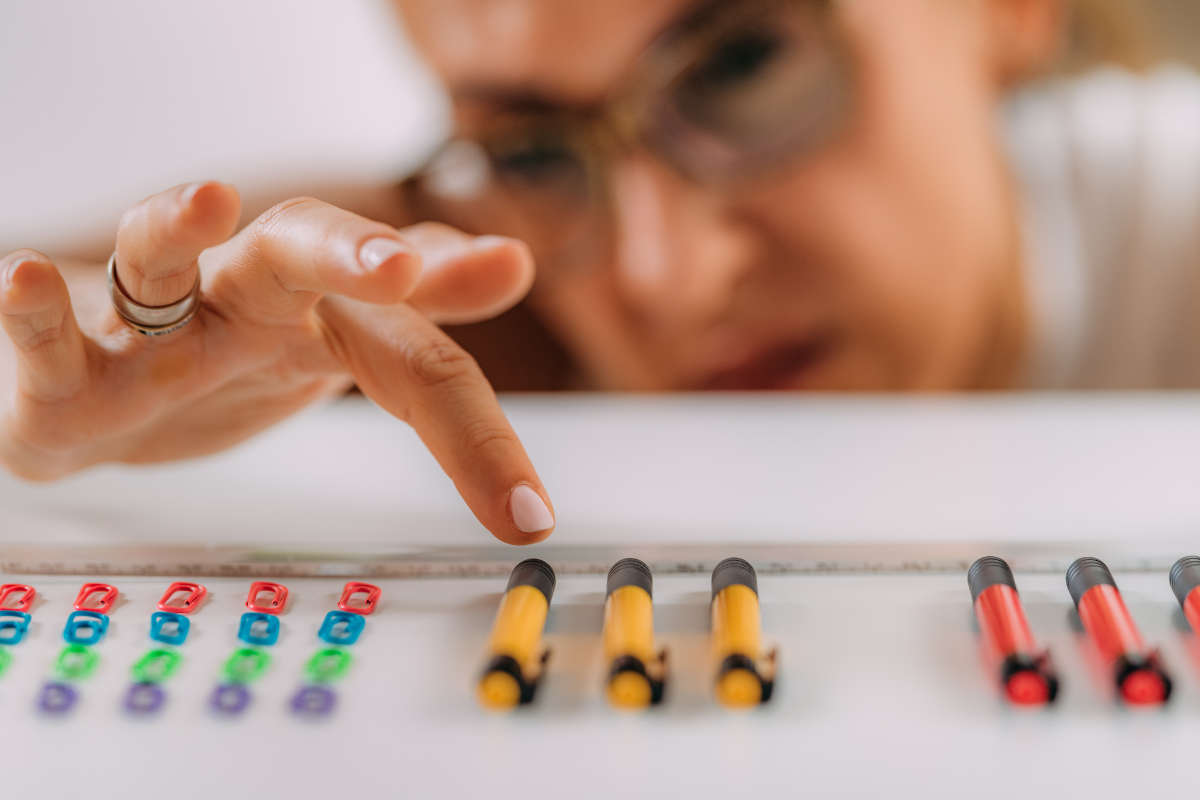 Person carefully aligning objects into even rows, reflecting the “not just right” feeling associated with symmetry OCD.