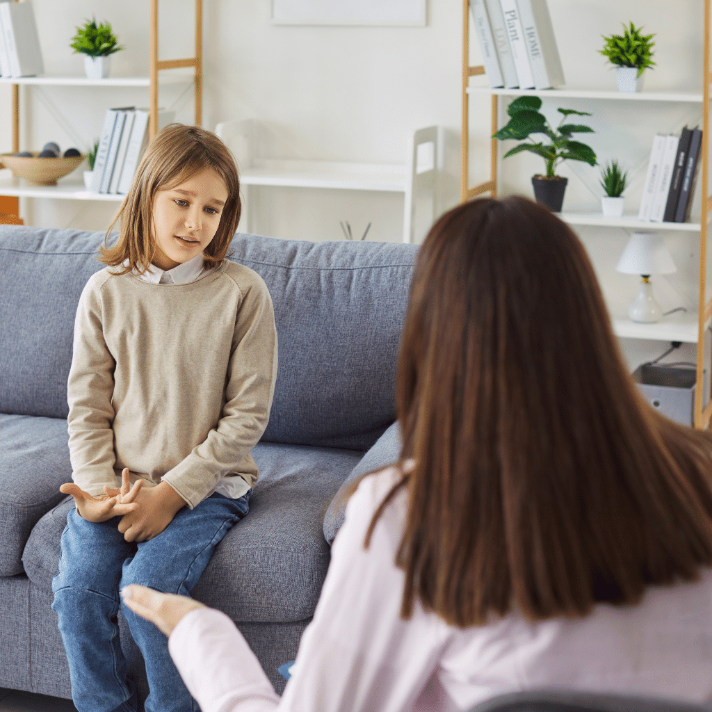 Child speaking with a mental health professional, showing how an ADHD evaluation can help parents understand ongoing focus, behavior, or impulse concerns.