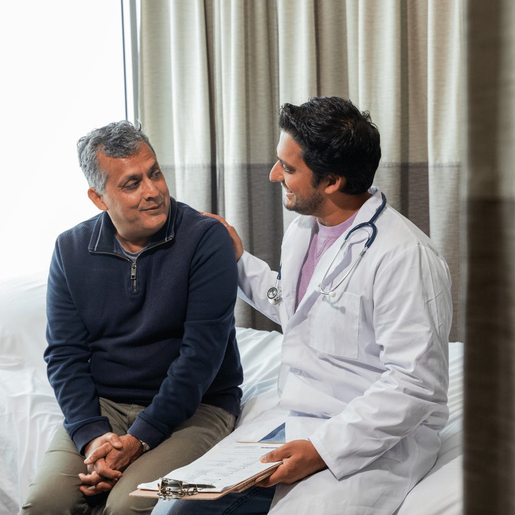 Patient speaking with a doctor about TMS treatment options, schedule, candidacy, and what to expect from an accelerated protocol.